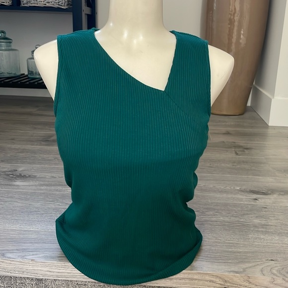 3/$35 Ricki’s tank tops SET in a gold sparkle and green asymmetrical neckline. - Picture 2 of 10